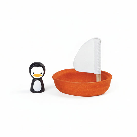 Jucărie de baie cu 1 bărcuță plutitoare și 1 figurină pinguin, Plan Toys